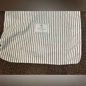 Anya Hindmarch dust cover tote.